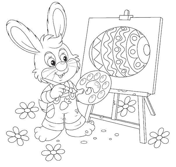   Пасхальный кролик рисует яичко