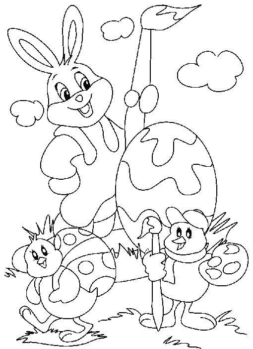   Кролик рисует на яйцах